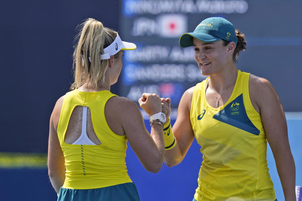 Ashleigh Barty, right, and Storm Sanders, both of Australia, play in a doubles match during the first round of the tennis competition at the 2020 Summer Olympics, Saturday, July 24, 2021, in Tokyo, Japan. (AP Photo/Seth Wenig)