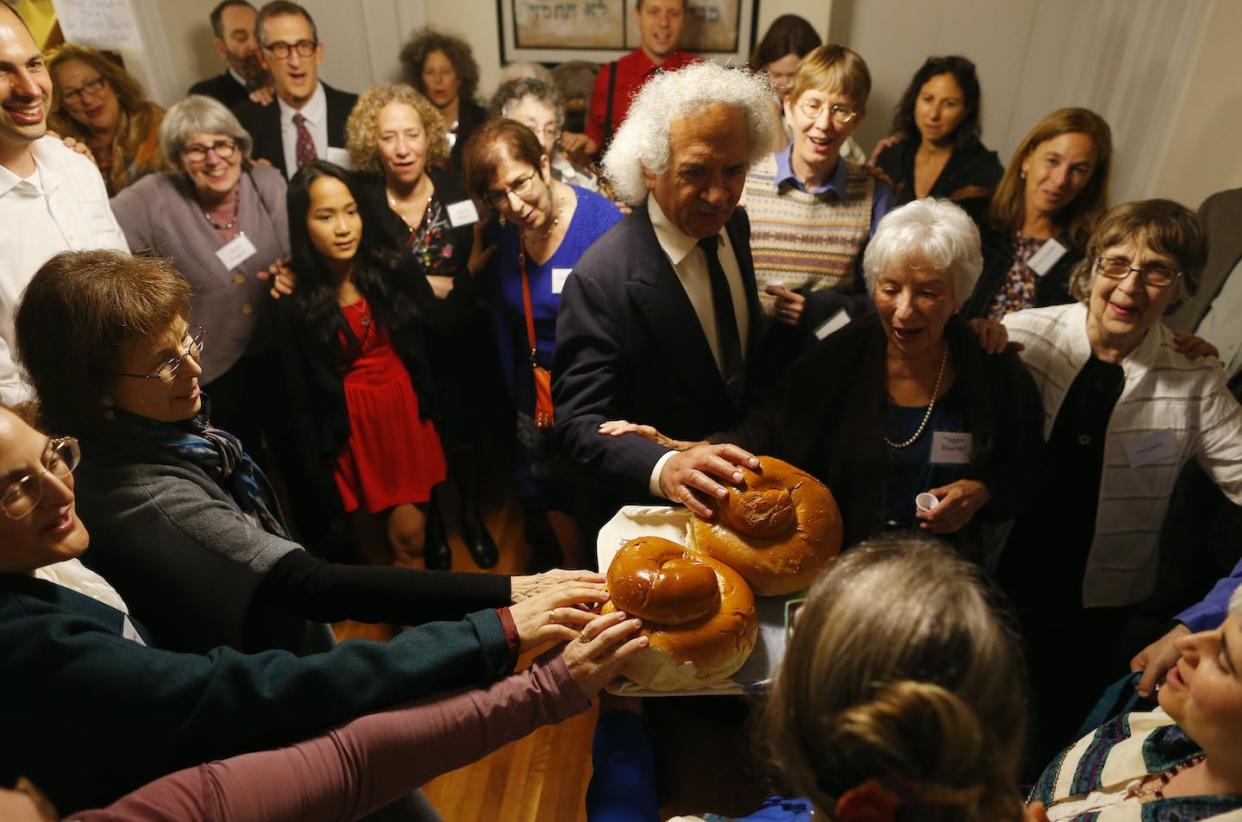 The Jewish High Holy Days commemorate concepts such as renewal, forgiveness, freedom and joy. <a href="https://www.gettyimages.com/detail/news-photo/congregation-eitz-chayim-join-together-for-the-kiddush-news-photo/456087872?adppopup=true" rel="nofollow noopener" target="_blank" data-ylk="slk:Jessica Rinaldi/The Boston Globe via Getty Images;elm:context_link;itc:0;sec:content-canvas" class="link ">Jessica Rinaldi/The Boston Globe via Getty Images</a>