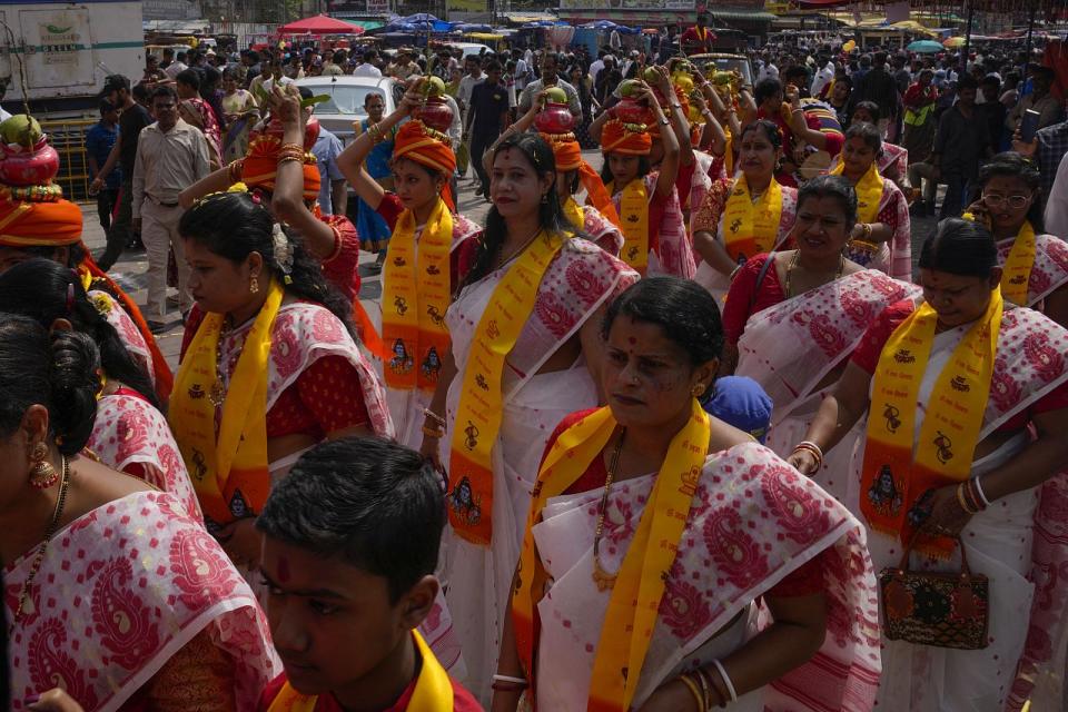 Hindu devotees participate in a religious procession during Diwali, the Hindu festival of lights in Hyderabad, India, Sunday, Nov. 12, 2023.