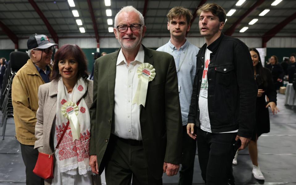 Mr Corbyn with his family after his victory was declared