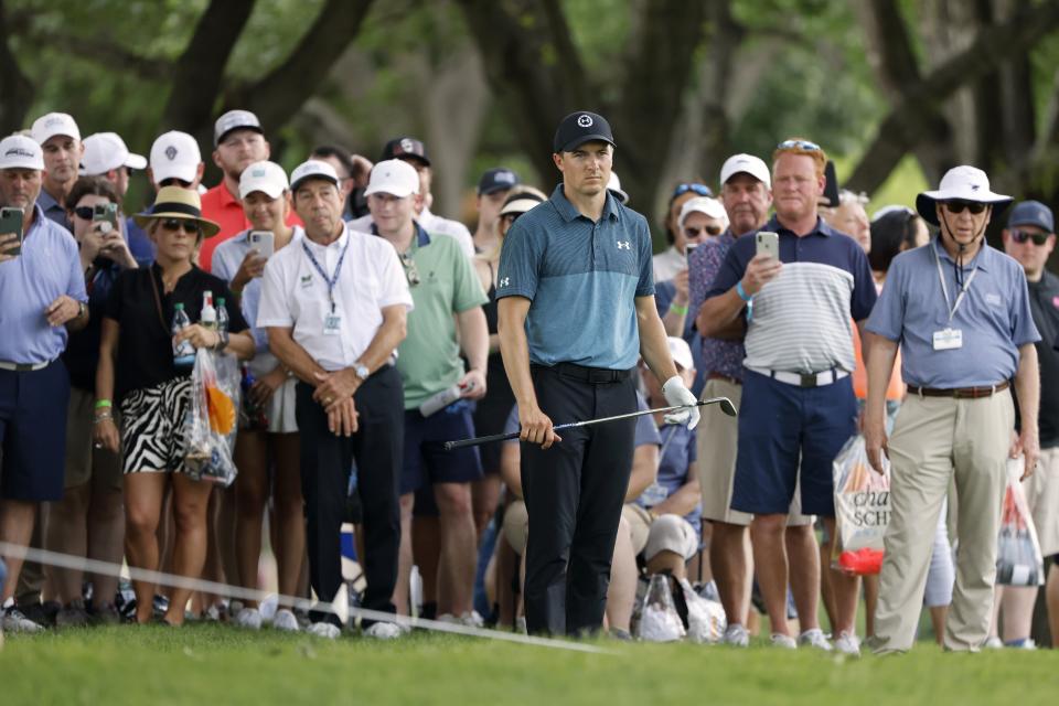 The gallery looks on as Jordan Spieth prepares to hit from behind the ropes during the third round of the Charles Schwab Challenge golf tournament at the Colonial Country Club in Fort Worth, Texas, Saturday May 29, 2021. (AP Photo/Ron Jenkins)