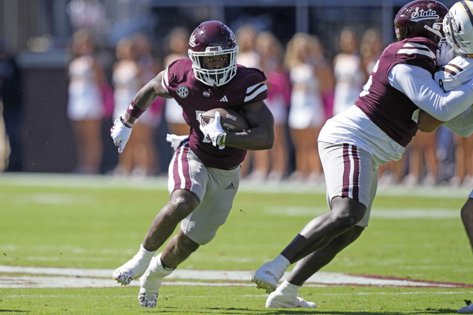 Mississippi State running back Jo'Quavious Marks (7) follows a blocker as he runs for a first down during the first half of an NCAA college football game against Western Michigan, Saturday, Oct. 7, 2023, in Starkville, Miss. Mississippi State won 41-28 (AP Photo/Rogelio V. Solis)