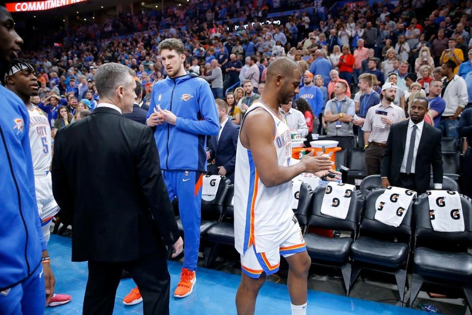 Oklahoma City coach Billy Donovan, Mike Muscala, and Chris Paul leave the court March 11, 2020, with the rest of the team before a game between the Oklahoma City Thunder and the Utah Jazz was postponed at Chesapeake Energy Arena.