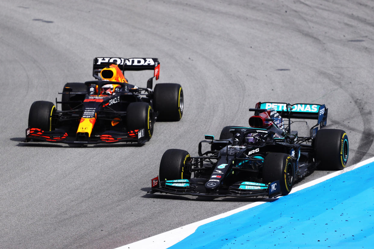 BARCELONA, SPAIN - MAY 09: Lewis Hamilton of Great Britain driving the (44) Mercedes AMG Petronas F1 Team Mercedes W12 leads Max Verstappen of the Netherlands driving the (33) Red Bull Racing RB16B Honda on track during the F1 Grand Prix of Spain at Circuit de Barcelona-Catalunya on May 09, 2021 in Barcelona, Spain. (Photo by Bryn Lennon/Getty Images)