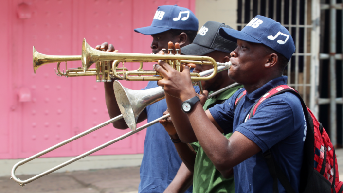 Students blow trumpets during a parade in Monrovia, Liberia - Tuesday 15 March 2022