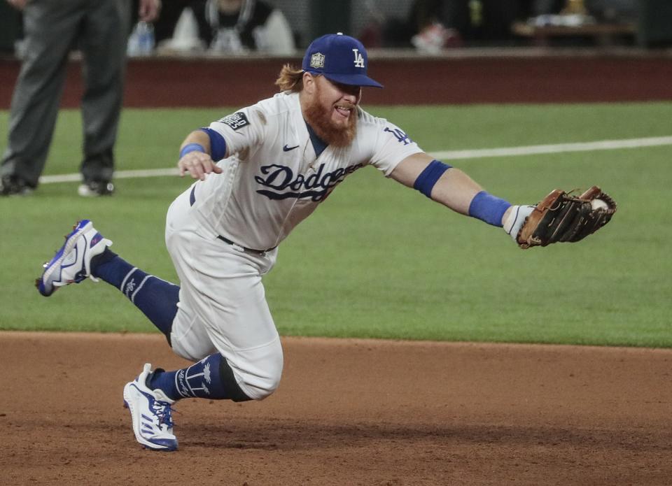 Dodgers third baseman Justin Turner snags a grounder.