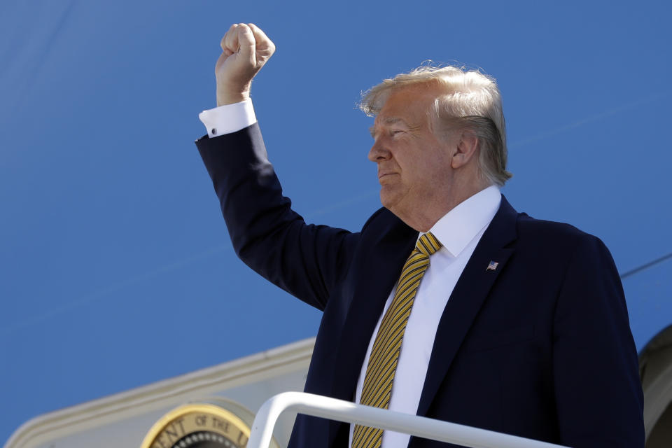 FILE- In this Sept. 17, 2019, file photo, President Donald Trump boards Air Force One at Albuquerque International Sunport in Albuquerque, N.M. A new poll by The Associated Press-NORC Center for Public Affairs Research finds about half of Americans think Donald Trump's actions as president have made things worse for African Americans, Muslims and women. (AP Photo/Evan Vucci, File)