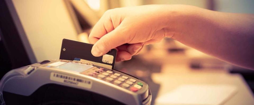 Moment of payment with a credit card through terminal.monochrome