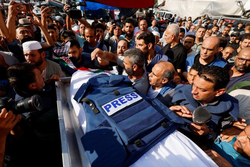 Mourners attend the funeral of Palestinian journalist Mohammed Abu Hattab who was killed in an Israeli strike, in Khan Younis (REUTERS)
