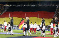 German players enter the pitch for a friendly soccer match between Germany and Peru in Sinsheim, Germany, Sunday, Sept. 9, 2018. (AP Photo/Michael Probst)