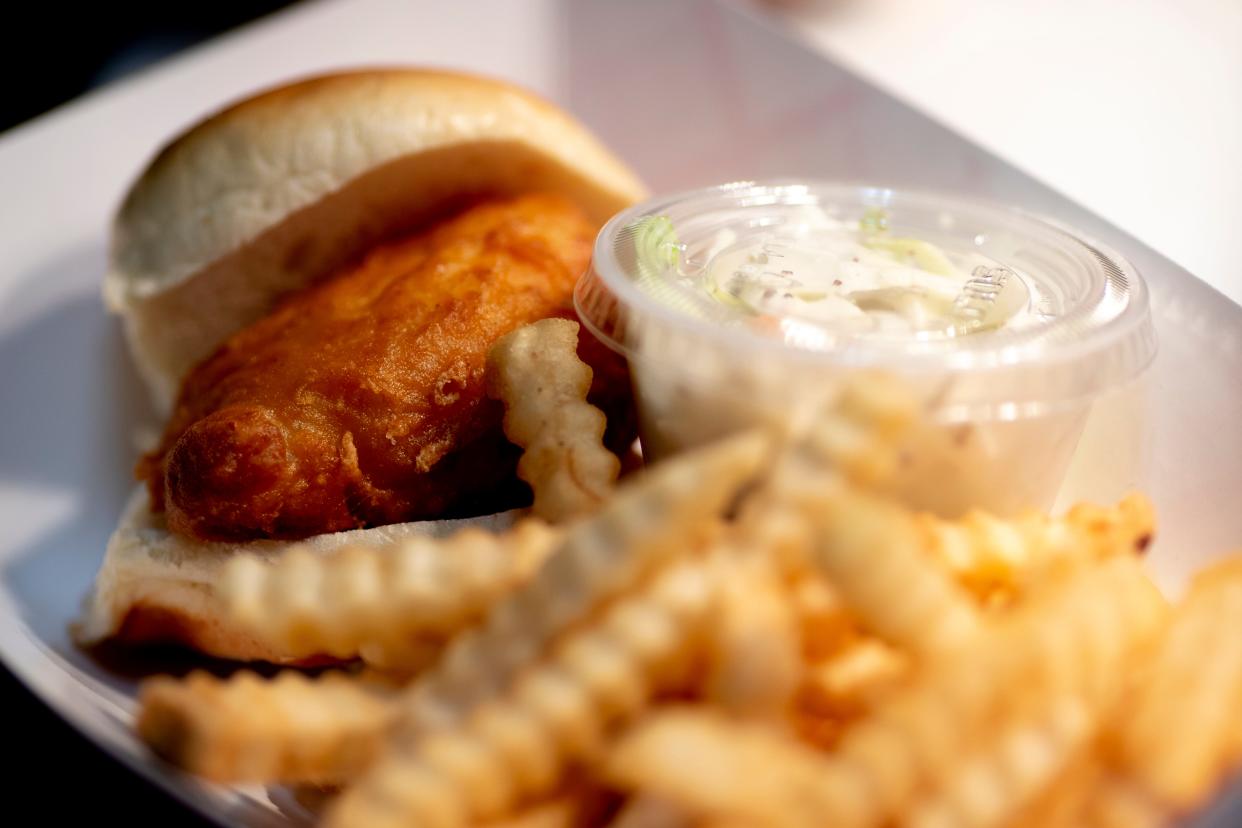 A cod slider sits with fries at the St. Catherine of Siena Church fish fry in 2022.