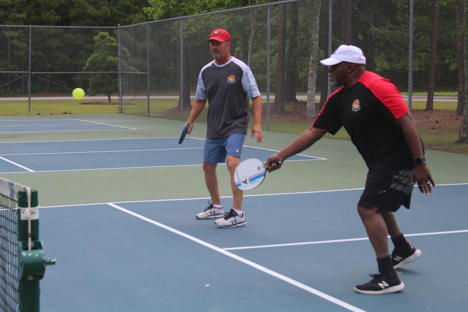 Jimmy Santangelo and Wilmington City Council member Clifford Barnett play in pickleball game against Dean Matt and Wayne Bigg at Northern Regional Park in Castle Hayne on Thursday. Matt is attempting to play a game of pickleball in each of the 48 contiguous U.S. states within a span of 26 days.