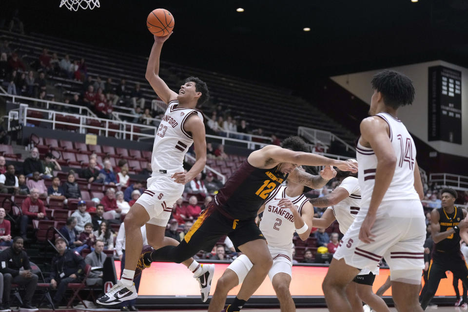 Stanford forward Brandon Angel (23) drives to the basket against Arizona State guard Jose Perez (12) during the second half of an NCAA college basketball game Friday, Dec. 29, 2023, in Stanford, Calif. (AP Photo/Tony Avelar)