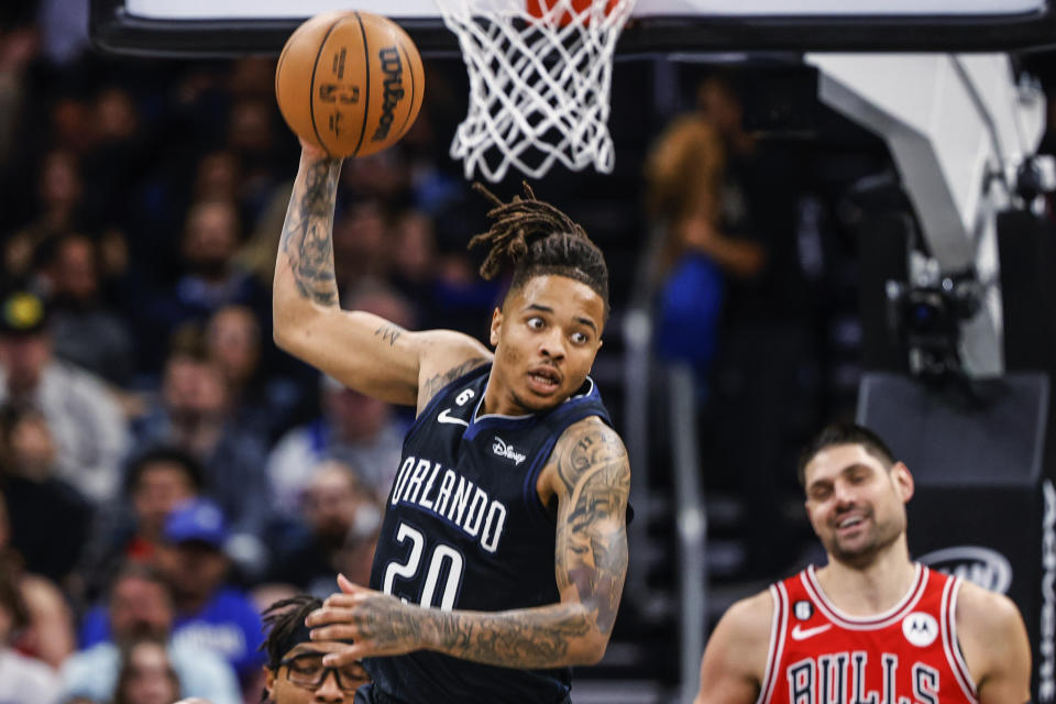 Orlando Magic guard Markelle Fultz (20) pulls down rebound against the Chicago Bulls during the first half of an NBA basketball game Saturday, Jan. 28, 2023, in Orlando, Fla. (AP Photo/Kevin Kolczynski)