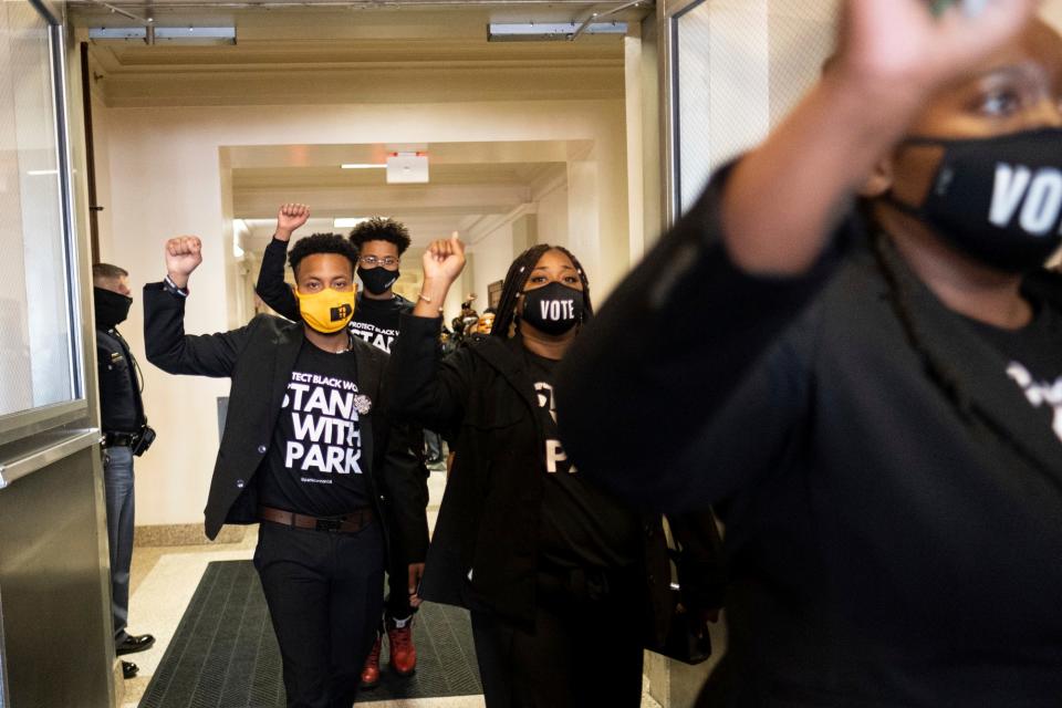 Supporters of Georgia state Rep. Park Cannon, D-Atlanta, leave the Capitol in Atlanta on March 29, 2021, after escorting her into the building. Cannon was arrested for knocking on the governor's office door as he signed voting legislation.
