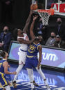 New York Knicks forward Julius Randle shoots over Golden State Warriors forward Draymond Green (23) during the second quarter of an NBA basketball game Tuesday, Feb. 23, 2021, in New York. (Wendell Cruz/Pool Photo via AP)