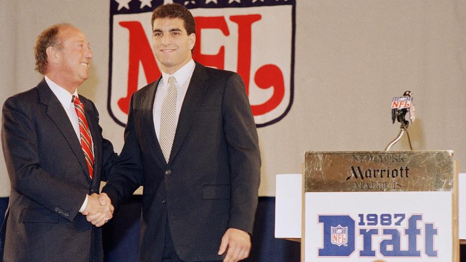 Mandatory Credit: Photo by Ray Stubblebine/AP/Shutterstock (6034808a)Vinny Testaverde Vinny Testaverde, right, the Heisman Trophy-winning quarterback from the University of Miami, shakes hands with NFL commissioner Pete Rozelle during the NFL draft in New York on .