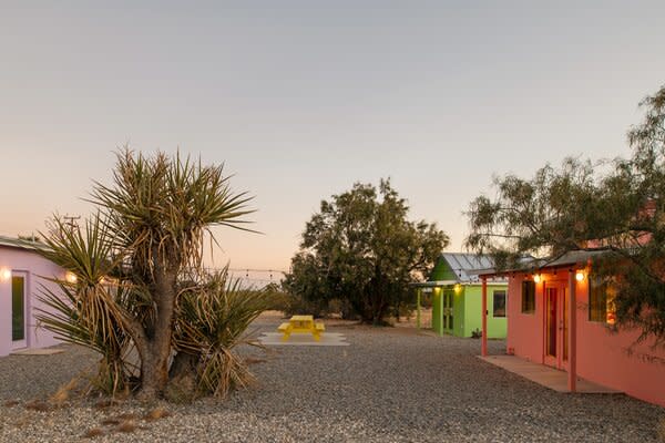 Each of the four structures were gutted to the studs and fully remodeled with modern amenities. The large gravel lot separating the buildings offers an idyllic entertaining setting.