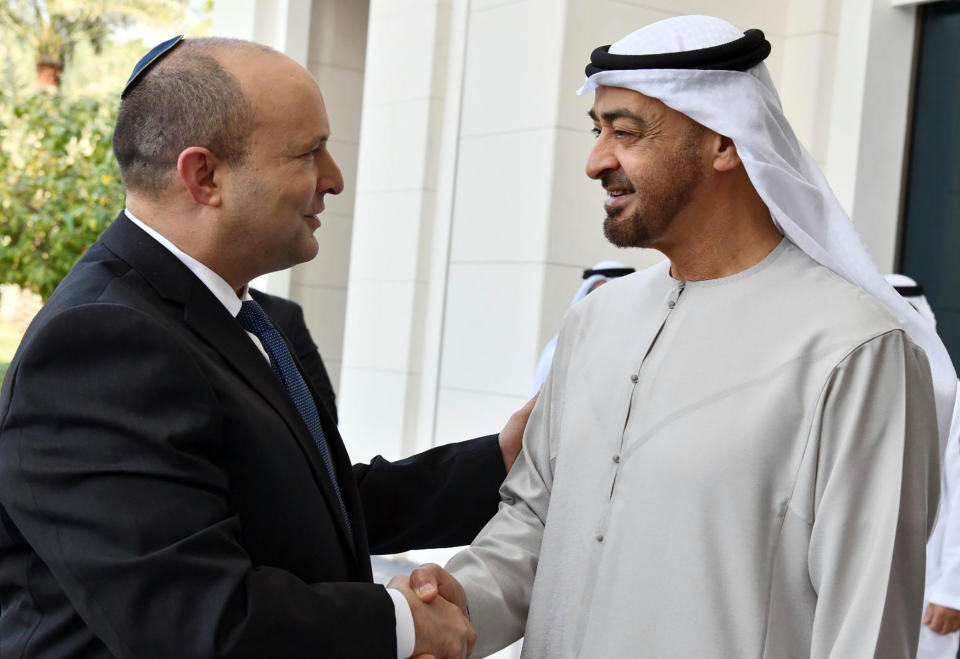 FILE - Israeli Prime Minister Naftali Bennett, left, shakes hands with Sheikh Mohammed bin Zayed Al Nahyan, then crown prince of Abu Dhabi in Abu Dhabi, United Arab Emirates, Dec. 13, 2021. Al Nahyan the newly appointed president has been receiving condolence visits from the world's elite for days now in Abu Dhabi. MbZ as he’s known has taken on a major influence in the wider Middle East, whether through his longtime relationship with the U.S. military, his opposition to Islamists and his autocratic country’s new ties with Israel. (Haim Zach/Israel Government Press Office via AP, File)