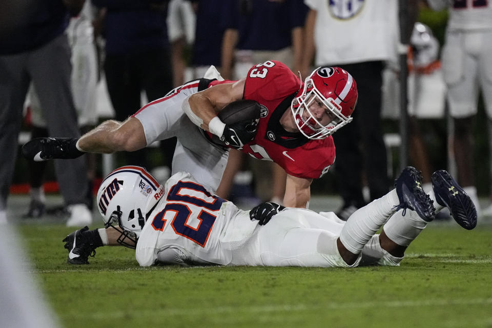 Georgia wide receiver Cole Speer (83) is brought down by Tennessee-Martin cornerback JaMichael McGoy Jr. (20) after a catch during the second half of an NCAA college football game Saturday, Sept. 2, 2023, in Athens, Ga. (AP Photo/John Bazemore)