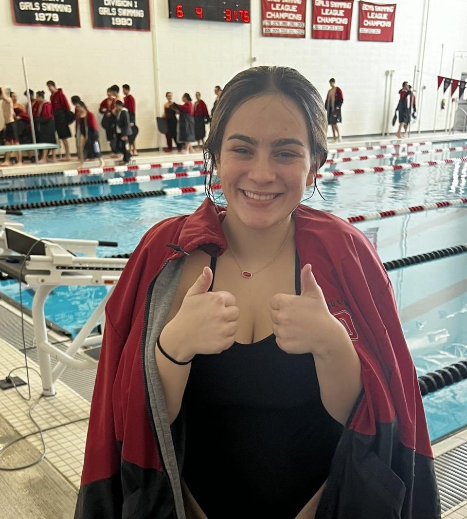 Durfee girls swimmer Casey Carvalho is thumbs up after qualifying for the MIAA diving championships.