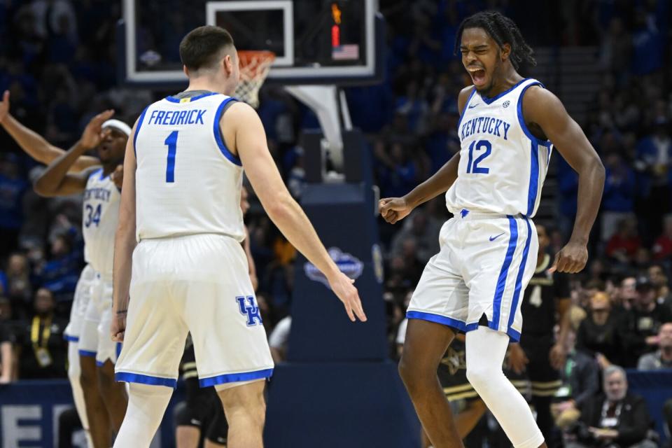 Kentucky guard Antonio Reeves celebrates with CJ Fredrick after making a three-point basket against Vanderbilt.