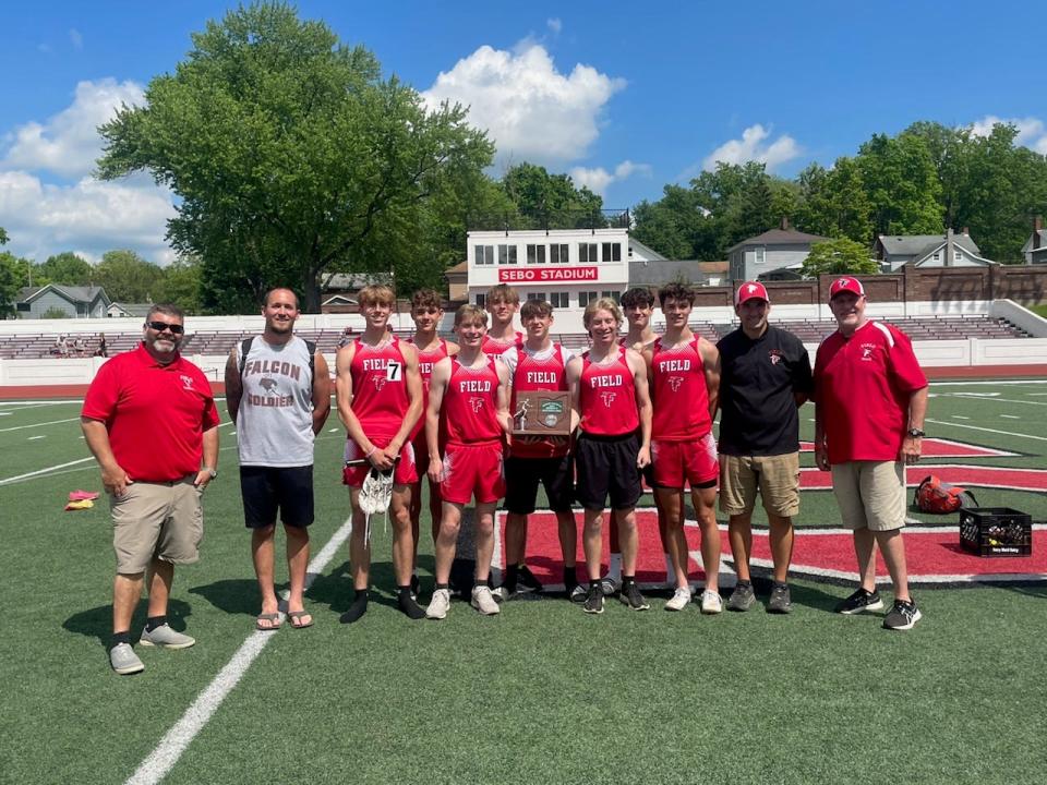 Members of the Field boys track and field team after earning district runner-up honors. A number of team members weren't present for the photo due to prom.