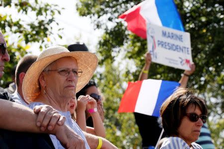 Supporters of Marine Le Pen, French National Front (FN) political party leader and a member of the European Parliament, attend a FN political rally in Brachay, France, September 3, 2016. REUTERS/Gonzalo Fuentes