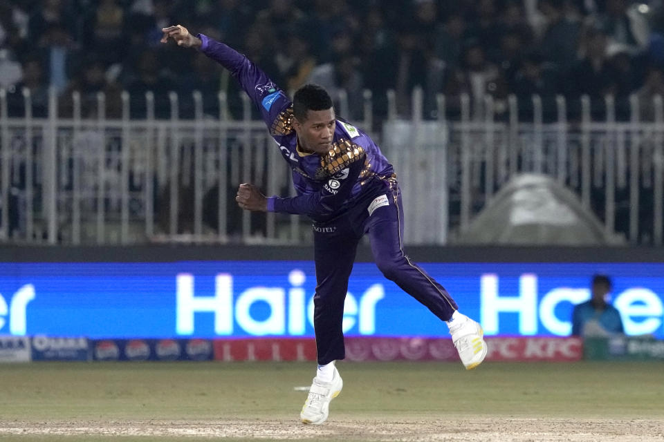 Quetta Gladiators' Akeal Hosein bowls during the Pakistan Super League T20 cricket match between Peshawar Zalmi and Quetta Gladiators, in Rawalpindi, Pakistan, Friday, March 8, 2024. (AP Photo/Anjum Naveed)