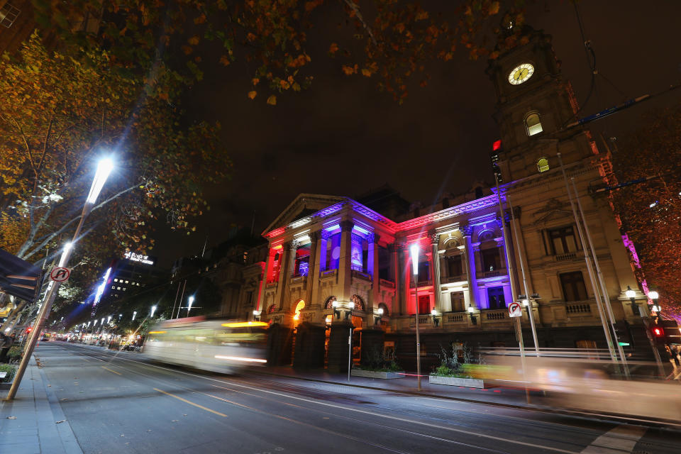 The colors of the Union Jack, the national flag of the United Kingdom, are projected onto Melbourne's town hall as a tribute to Manchester bombing victims.