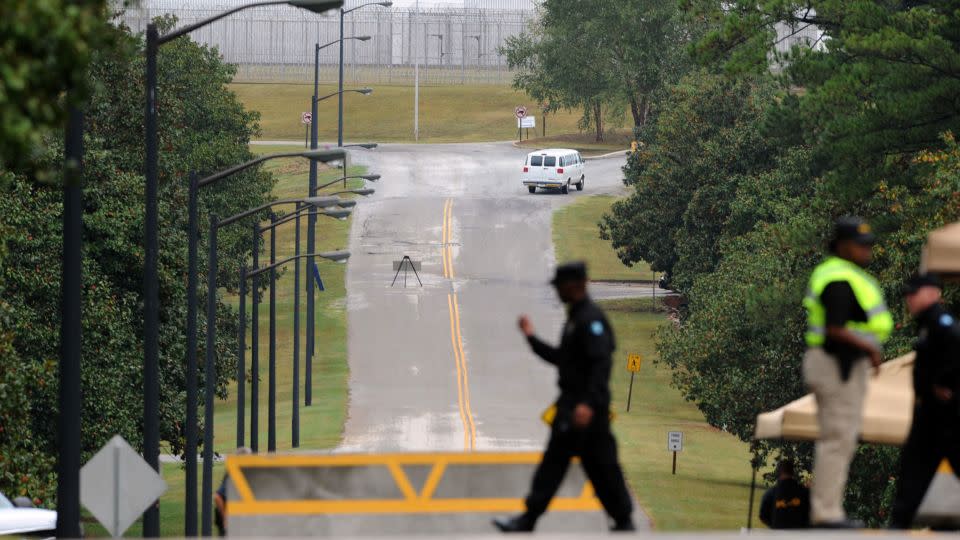 A Georgia Department of Corrections officer walks in 2011 at the entrance to the Georgia Diagnostic and Classification Prison in Jackson. - Erik S. Lesser/AFP/Getty Images