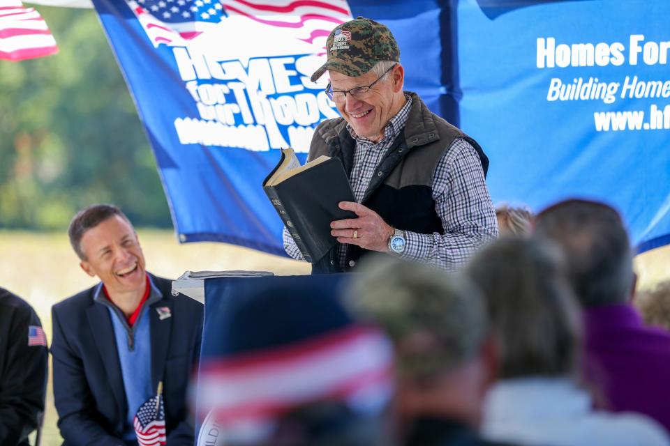 Craig Chambers, father of Marine LCpl. Bryan Chambers, speaks about his son's life journey to the crowd that gathered to see Chambers' new home, on Saturday, Oct. 1, 2022, in Attica, Ind.