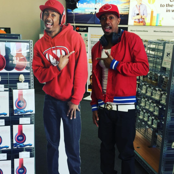 Nick Cannon poses with himself