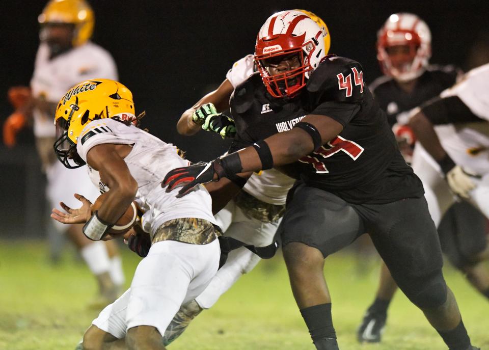 Westside defensive tackle Jordan Hall helps with the tackle on Ed White quarterback Gabriel Garmon during an Oct. 27 game.