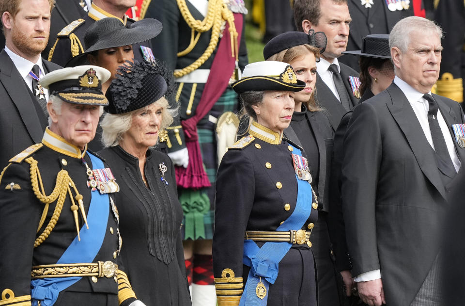 Britain's King Charles III , Camilla, the Queen Consort, Princess Anne, and Prince Andrew, from left, standing together during the state funeral service of Queen Elizabeth II in central London, England, Monday Sept. 19, 2022.(AP Photo/Martin Meissner)