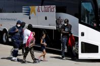 Migrants seeking asylum in the U.S. board a bus to Houston from Val Verde Border Humanitarian Coalition after being released from U.S. Customs and Border Protection, in Del Rio