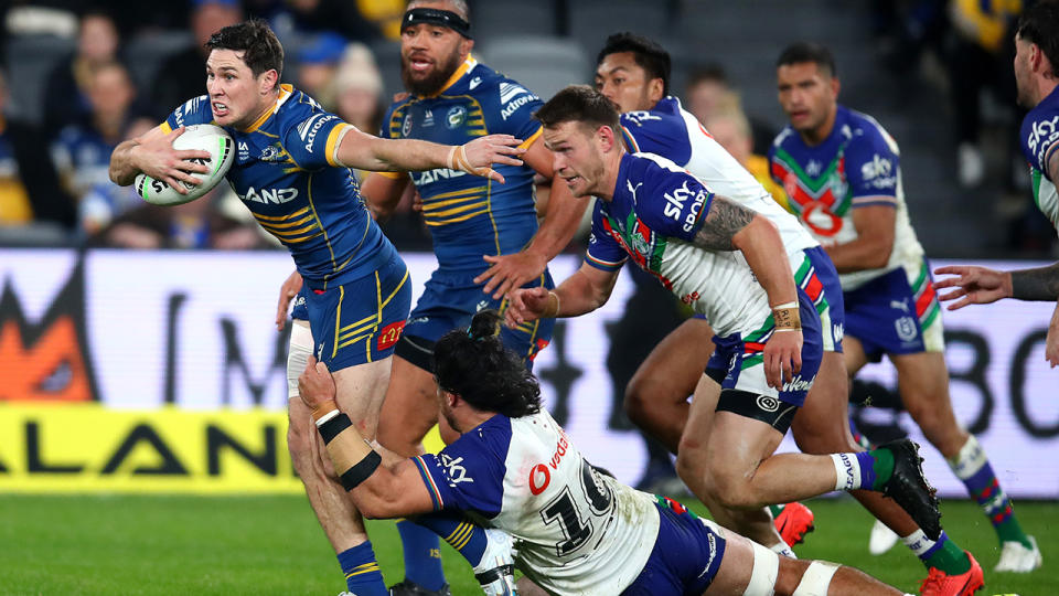 Mitchell Moses breaks through a tackle against the New Zealand Warriors.