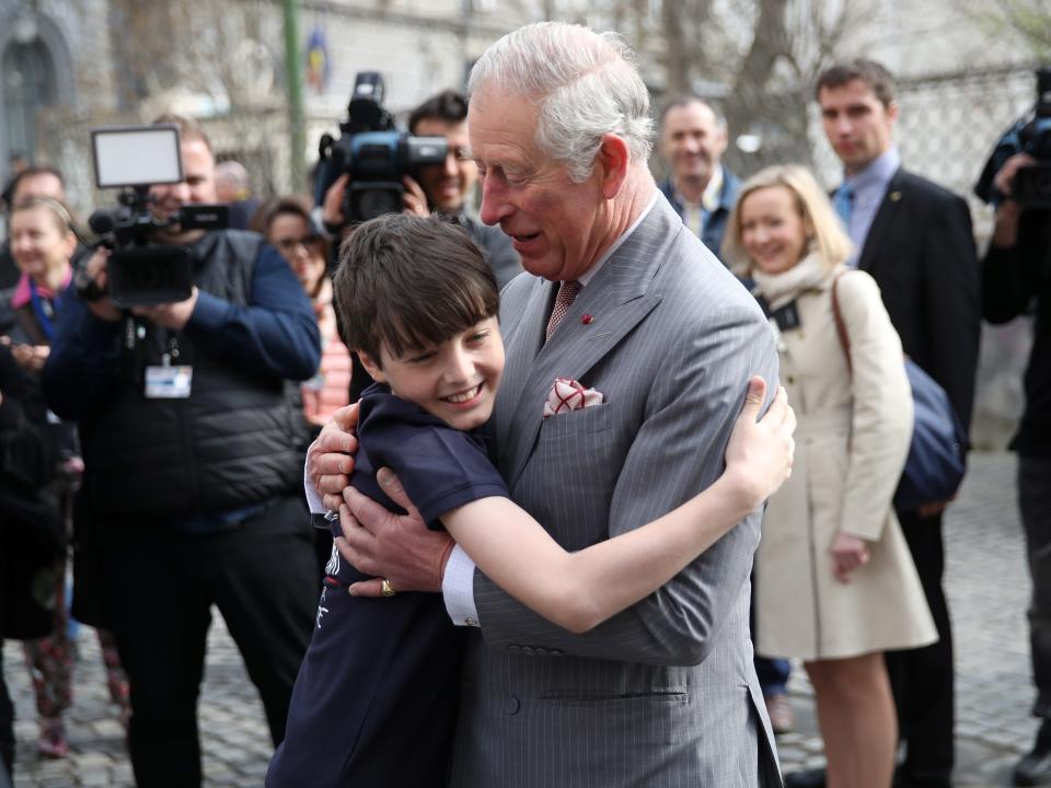 king charles receives a hug from valentin blacker in 2017