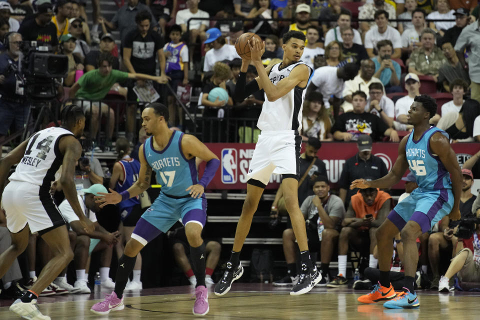 San Antonio Spurs' Victor Wembanyama grabs a pass against the Charlotte Hornets during the second half of an NBA summer league basketball game Friday, July 7, 2023, in Las Vegas. (AP Photo/John Locher)