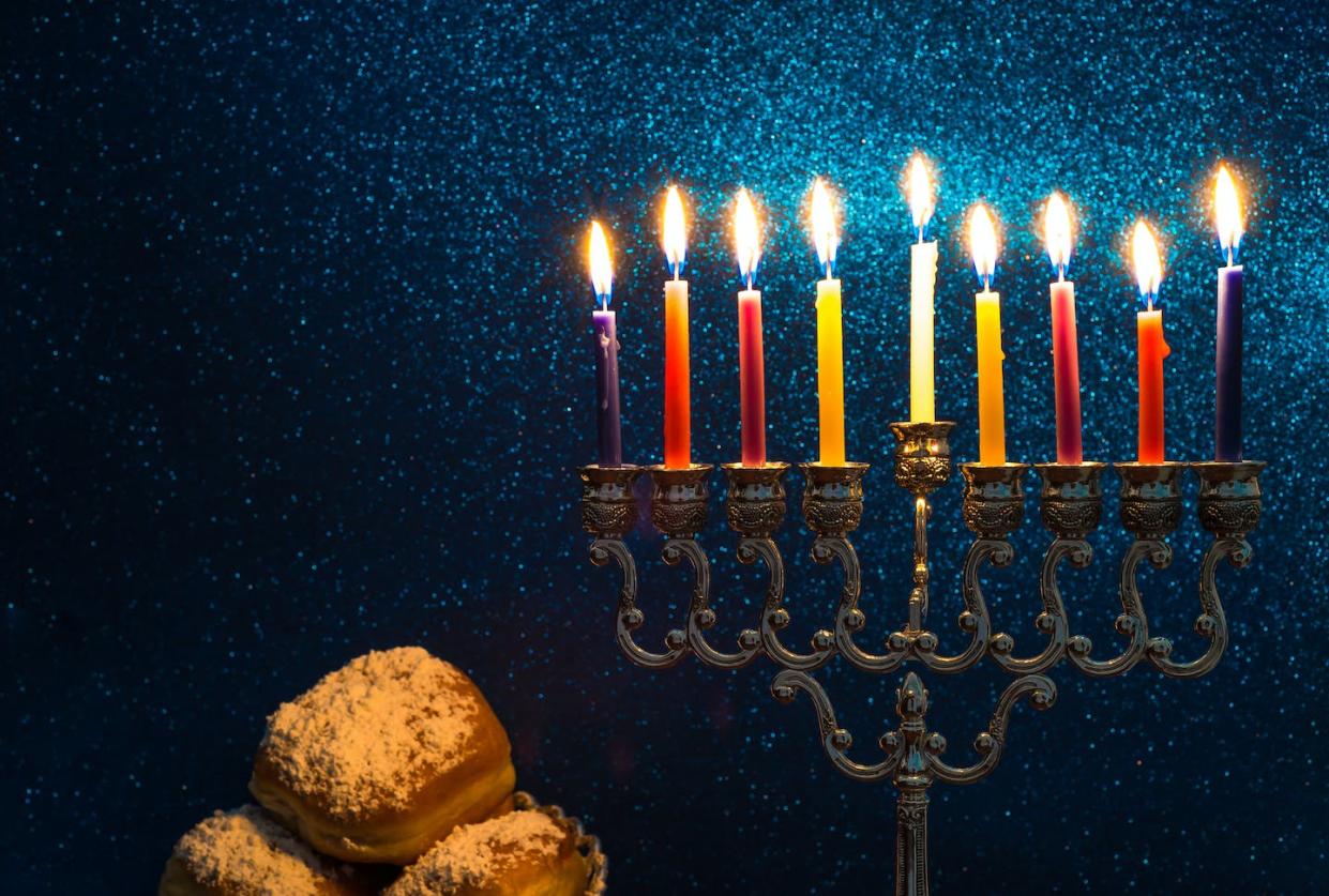 Hanukkah creates opportunities for families to celebrate their heritage – especially in the kitchen. <a href="https://www.gettyimages.com/detail/photo/image-of-the-hanukkah-jewish-holiday-with-a-menorah-royalty-free-image/889576958?phrase=hanukkah%20morocco&adppopup=true" rel="nofollow noopener" target="_blank" data-ylk="slk:zilber42/iStock via Getty Images;elm:context_link;itc:0;sec:content-canvas" class="link ">zilber42/iStock via Getty Images</a>