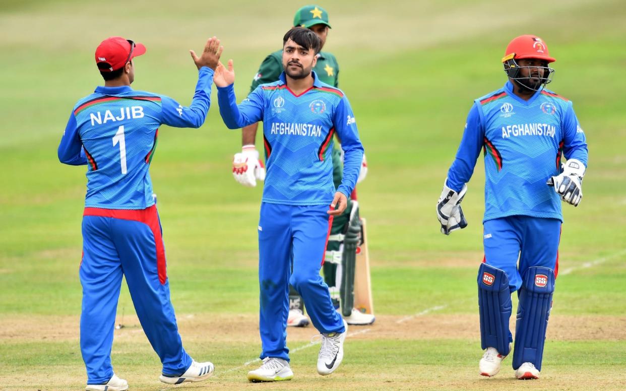 Rashid Khan takes the wicket of Pakistan captain Sarfraz Ahmed during Afghanistan's victory in the World Cup warm-up at Bristol - AFP