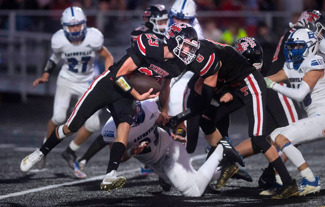 Tenino running back Dylan Spicer tries to slip past Eatonville defensive lineman Evan Wimbles during Friday night’s 2A football game at Tenino Beaver Stadium in Tenino, Washington, on Sept. 30, 2022.