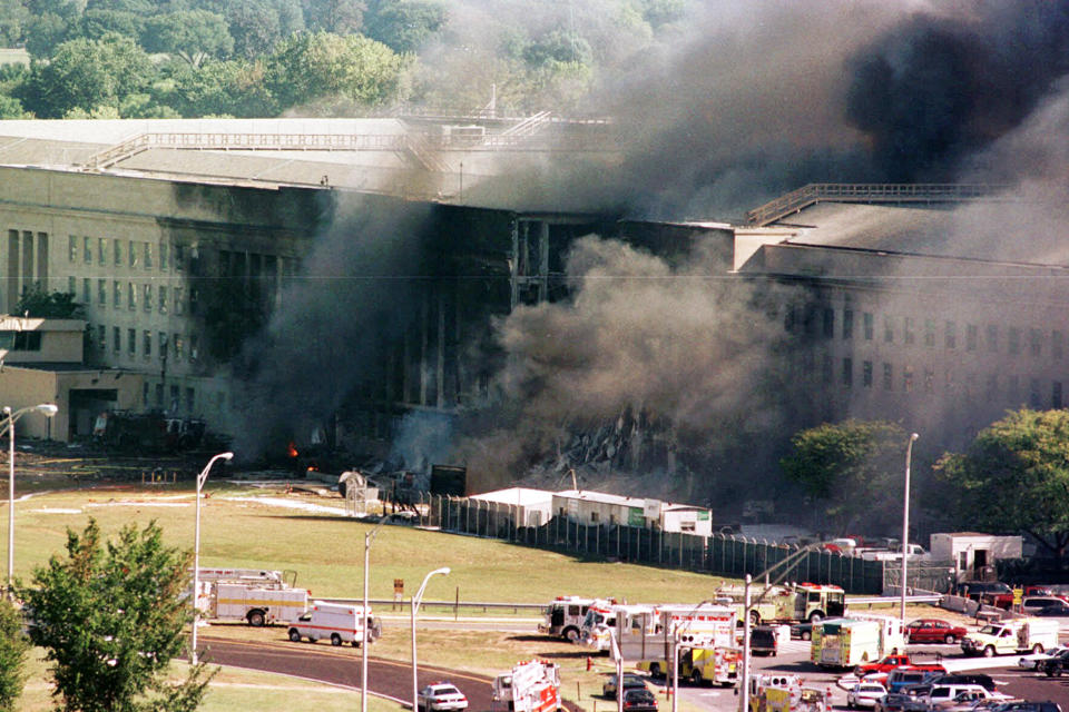 FILE - The south side of the Pentagon burns after a plane crash in Washington, Sept. 11, 2001. President Joe Biden signed an executive order, Friday, Feb. 11, 2022, to create a pathway to split $7 billion in Afghan assets frozen in the U.S. to fund humanitarian relief in Afghanistan and to create a trust fund to compensate Sept. 11 victims. (AP Photo/Tom Horan, File)