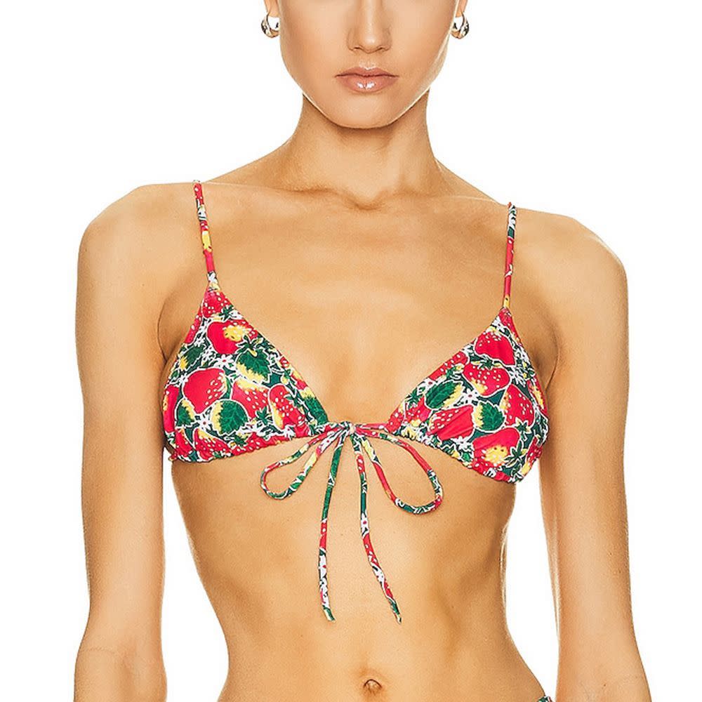 <p><a href="https://go.redirectingat.com?id=74968X1596630&url=https%3A%2F%2Fwww.fwrd.com%2Fproduct-heavy-manners-triangle-front-tie-bikini-top%2FHNNF-WX22%2F&sref=https%3A%2F%2F" rel="nofollow noopener" target="_blank" data-ylk="slk:Shop Now;elm:context_link;itc:0;sec:content-canvas" class="link rapid-noclick-resp">Shop Now</a></p><p>Triangle Front Tie swimsuit Top </p><p>fwrd.com</p><p>$77.00</p>