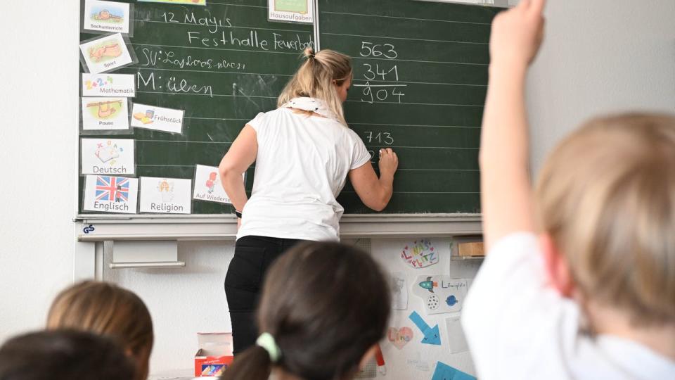 <div>Students at an elementary school work on math problems in a classroom.</div> <strong>(Bernd Weißbrod/picture alliance via Getty Images)</strong>