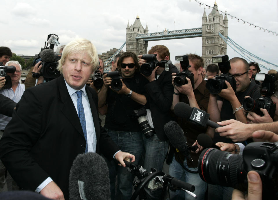 FILE - Britain Conservative Party MP, Boris Johnson, left, speaks to the media to launch his campaign as a candidate to be the Mayor of London, outside City Hall in central London, Monday, July 16, 2007. British media say Prime Minister Boris Johnson has agreed to resign on Thursday, July 7 2022, ending an unprecedented political crisis over his future. (AP Photo/Sang Tan, File)