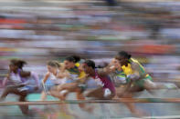 Kendra Harrison, of the United States, 3rd right, competes in a women's 100-meter hurdles heat during the World Athletics Championships in Budapest, Hungary, Tuesday, Aug. 22, 2023. (AP Photo/Ashley Landis)