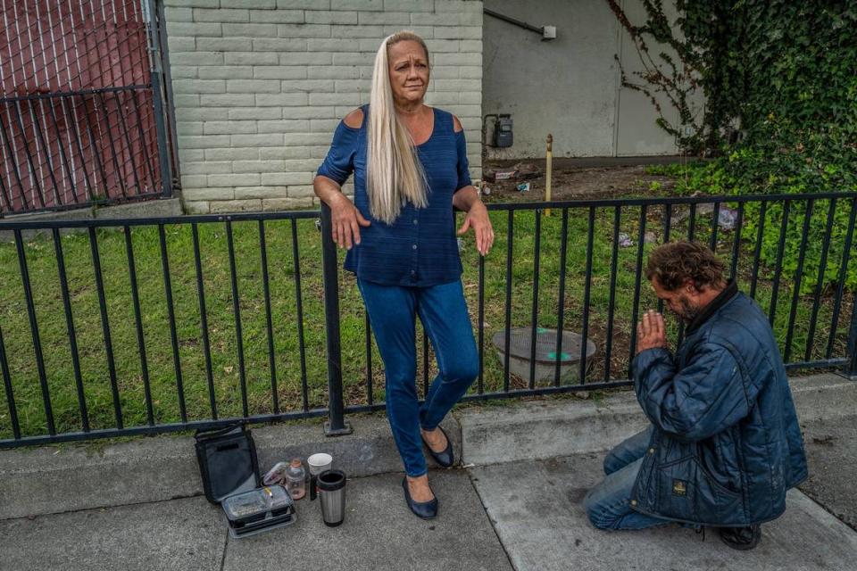 Linda Privatte patiently waits as her brother Mark Rippee who is blind and mentally ill, rants on the sidewalk while she was visiting with him in Vacaville earlier this month. “When he was in a nursing home for 8 1/2 months he made vast improvement. We thought that was our proof that he had been treated with medication, that he had been fed and he had been housed and the difference was amazing and then they put him right back on the streets,” said Privatte.