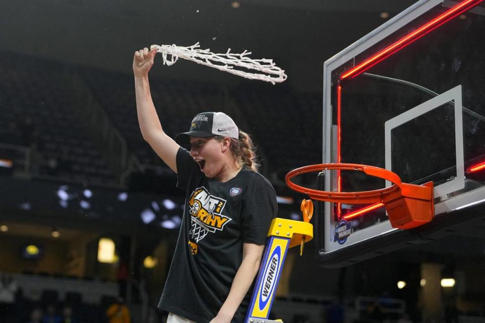 Iowa Hawkeyes guard Kate Martin (20) cuts the net after defeating the LSU Lady Tigers in the finals of the Albany Regional in the 2024 NCAA Tournament at MVP Arena. Mandatory Credit: Gregory Fisher-USA TODAY Sports