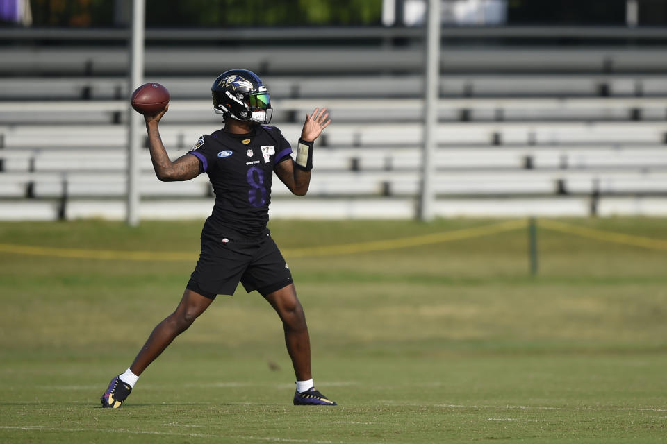Baltimore Ravens quarterback Lamar Jackson throws during an NFL football practice, Monday, Aug. 9, 2021 in Owings Mills, Md.(AP Photo/Gail Burton)